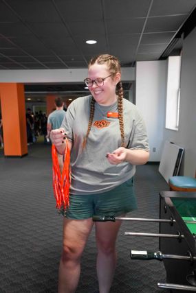 Conference Services worker holding lanyards