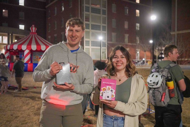 two students at late night event at the commons