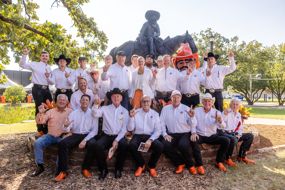 Past Pistol Pete mascots gather for the monument dedication.