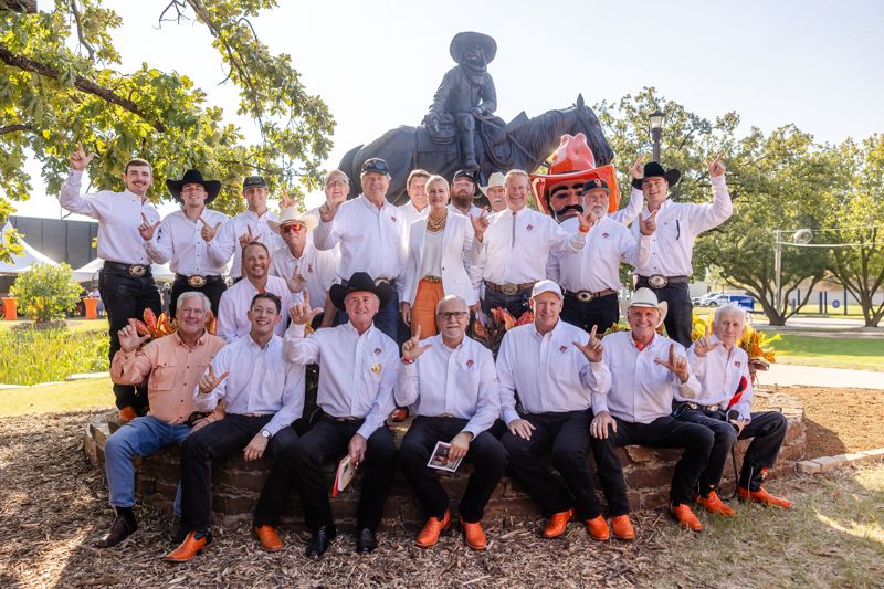 Past Pistol Pete mascots gather for the monument dedication.