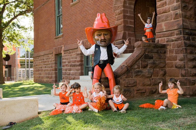 Pistol Pete and kids in OSU spirit gear