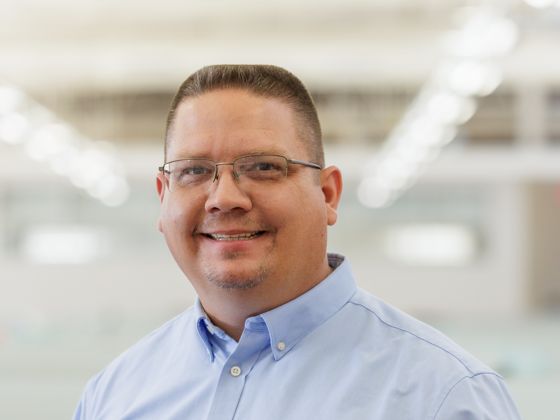 Man wearing a blue collared shirt