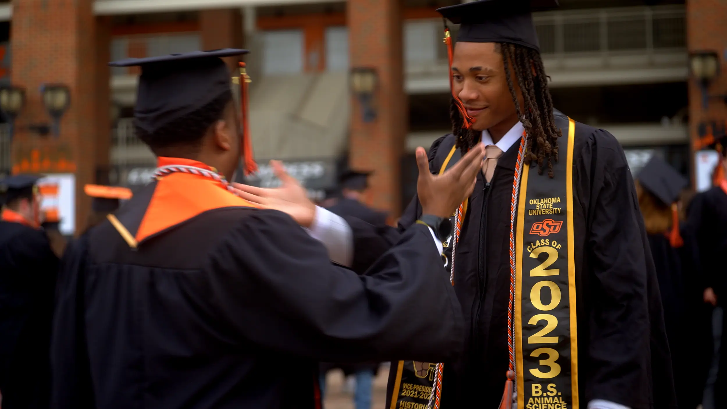 Students celebrating at graduation.