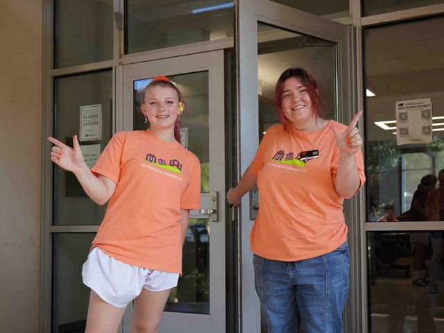 two students at doors