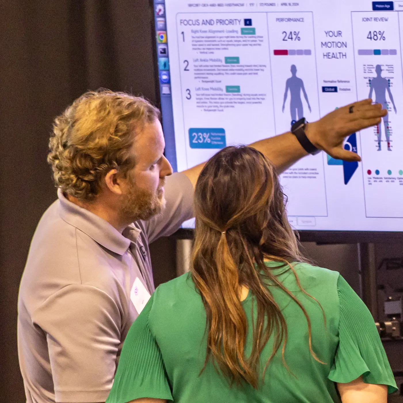 Student showing someone data from a physical health study.