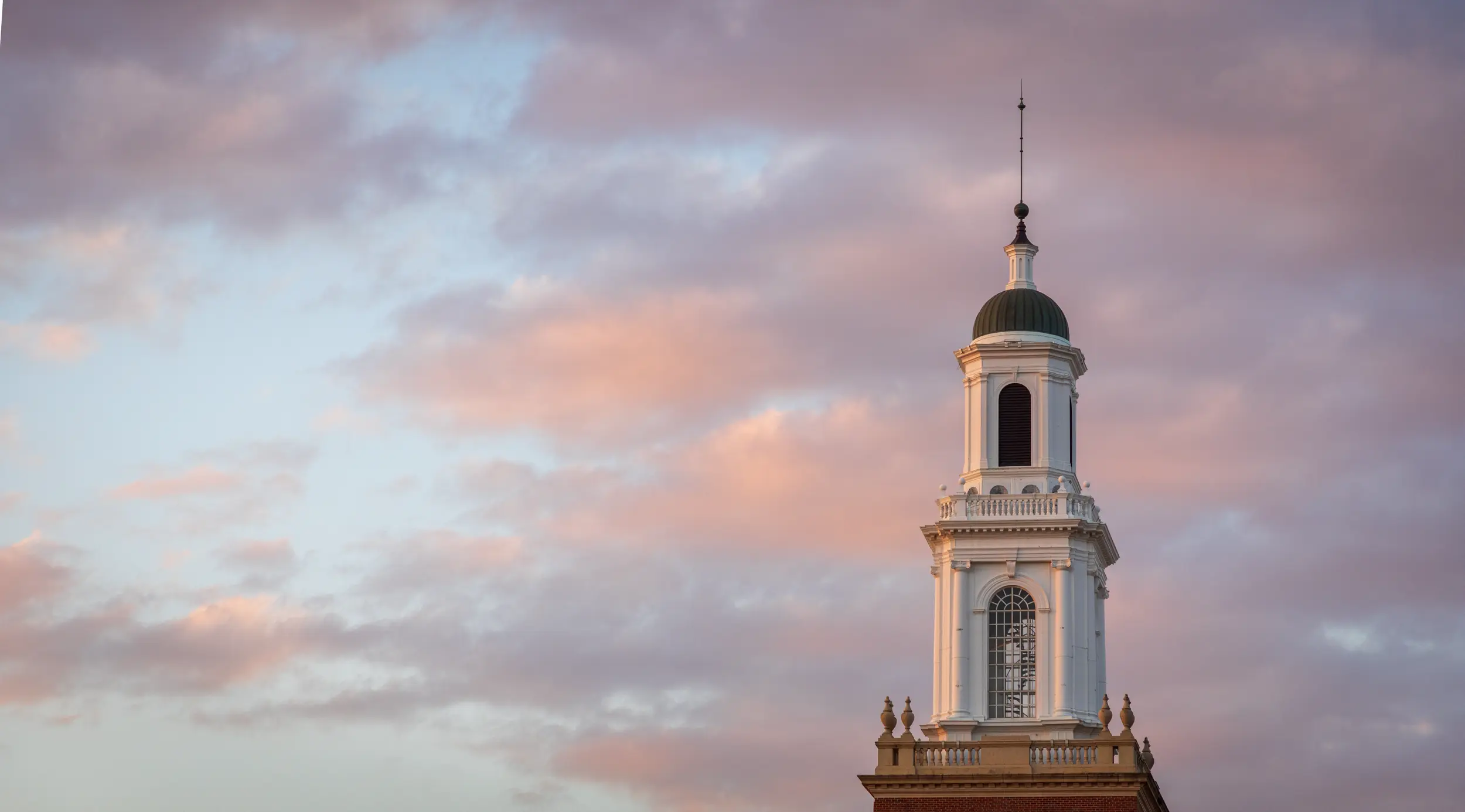 Edmon Low Library Tower against a dusk sky.