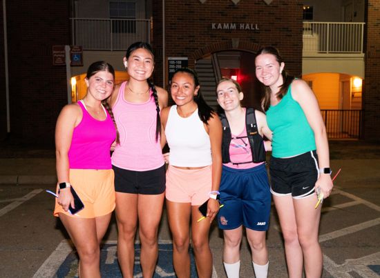 5 girls smiling at the camera. 