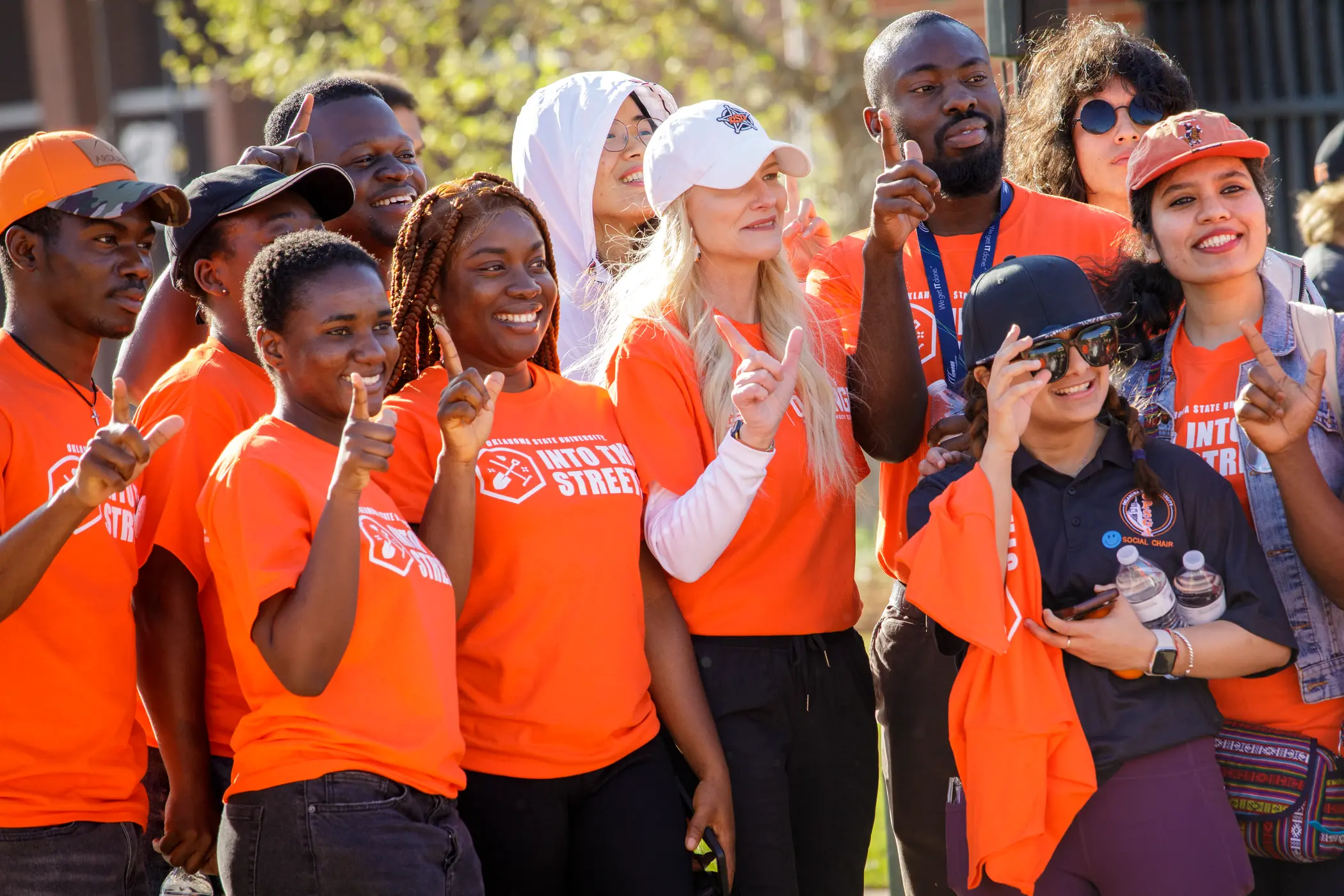 Dr. Shrum and group of students pose for photo during event.