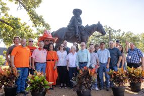 The family of Frank Eaton poses in front of the monument.